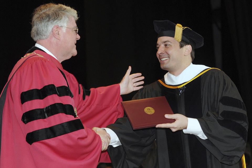 FILE - College of Saint Rose's President R. Mark Sullivan, left, presents "Tonight Show" host Jimmy Fallon with his bachelor's degree in communications during the College of Saint Rose's 86th Annual Commencement at the Saratoga Performing Arts Center in Saratoga Springs, N.Y., May 9, 2009. The College of Saint Rose, a small Roman Catholic college in Albany, New York, will close in May 2024 after years of financial struggles, officials said. (AP Photo/Hans Pennink, File)