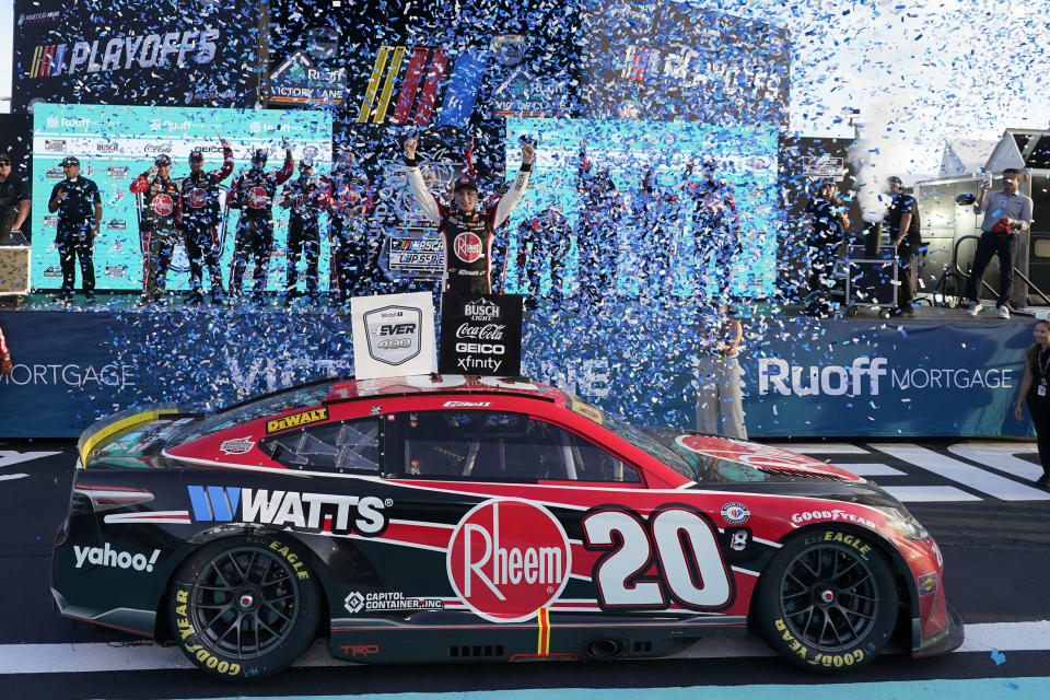 Christopher Bell, center, celebrates after winning the NASCAR Cup Series auto race at Homestead-Miami Speedway, Sunday, Oct. 22, 2023, in Homestead, Fla. (AP Photo/Wilfredo Lee)