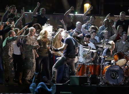 Metallica performs with U.S. military personnel and veterans during the Concert for Valor on the National Mall on Veterans' Day in Washington, November 11, 2014. REUTERS/Jonathan Ernst