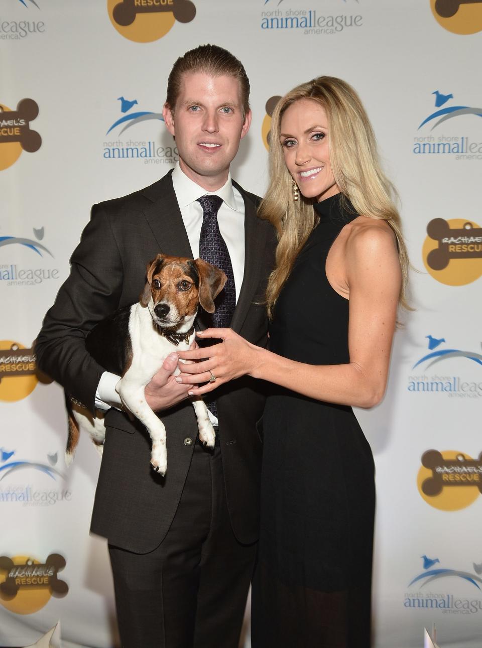 Eric and Lara Trump pose with their dog