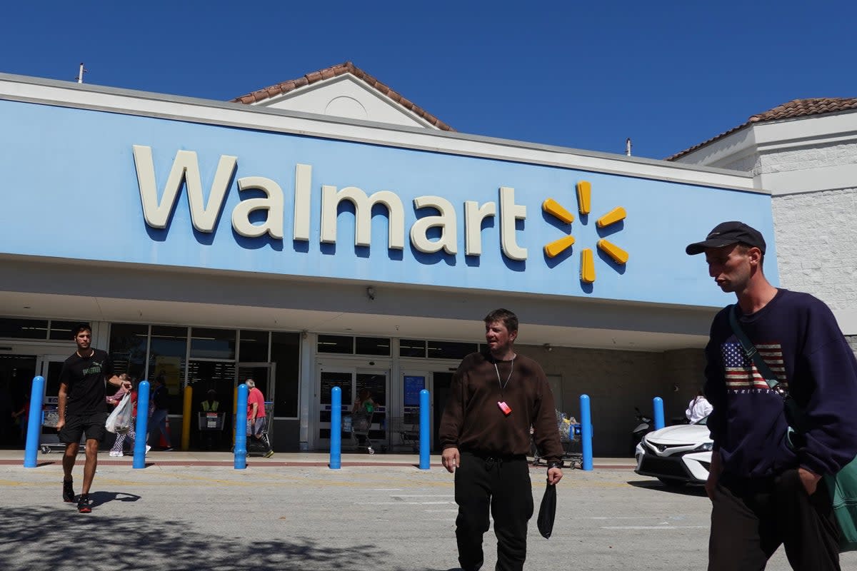 People walk near the entrance to a Walmart Supercenter on February 20, 2024, in Hallandale Beach, Florida.  (Getty Images)
