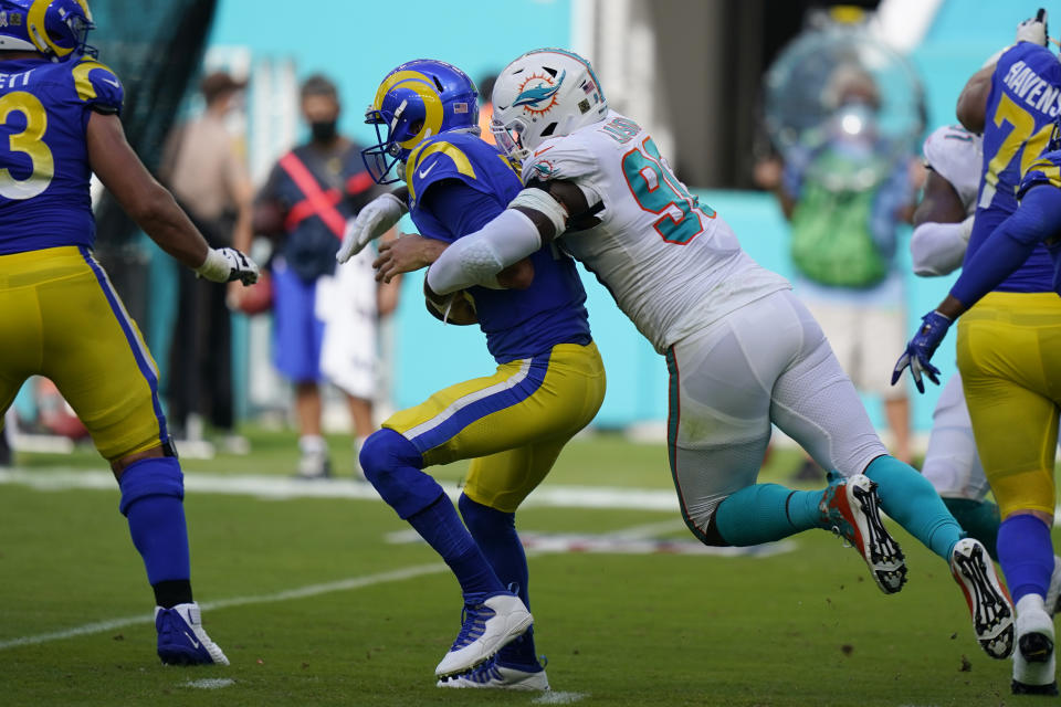 Miami Dolphins defensive end Shaq Lawson (90) sacks Los Angeles Rams quarterback Jared Goff (16), during the first half of an NFL football game, Sunday, Nov. 1, 2020, in Miami Gardens, Fla. (AP Photo/Wilfredo Lee)