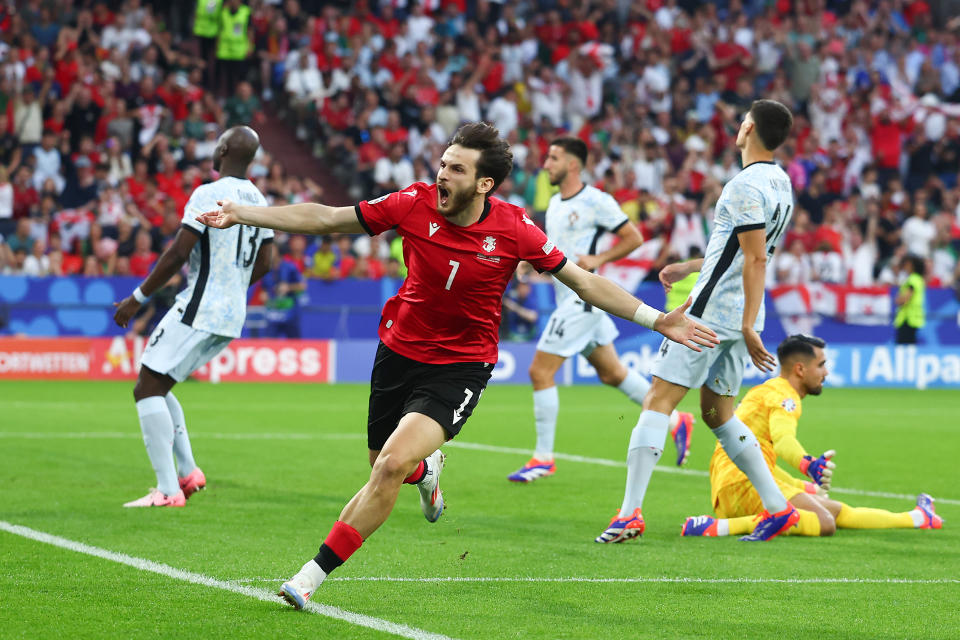 Georgia's Khvicha Kvaratskhelia celebrates scoring the first goal against Portugal. (Chris Brunskill/Fantasista/Getty Images)