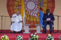 Pope Francis, left, meets authorities, civil society and diplomatic corps with President of the Democratic Republic of the Congo Felix-Antoine Tshisekedi Tshilombo, in the garden of the "Palais de la Nation" in Kinshasa, Democratic Republic of the Congo, Tuesday, Jan. 31, 2023. Pope Francis starts his six-day pastoral visit to Congo and South Sudan where he'll bring a message of peace to countries riven by poverty and conflict. (AP Photo/Gregorio Borgia)