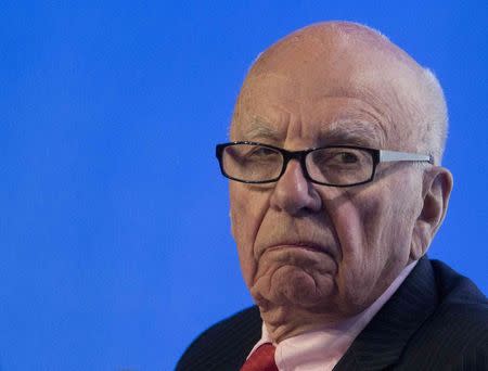 Rupert Murdoch, executive chairman of News Corporation, reacts during a panel discussion at the B20 meeting of company CEOs in Sydney, in this July 17, 2014 file photo. REUTERS/Jason Reed/Files