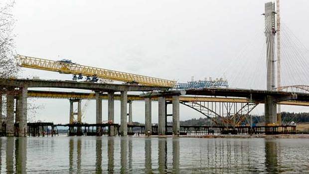 A 720-tonne gantry crane tipped off its rails on Friday, dropping a section of the new Port Mann bridge into the Fraser River, just east of Vancouver. 