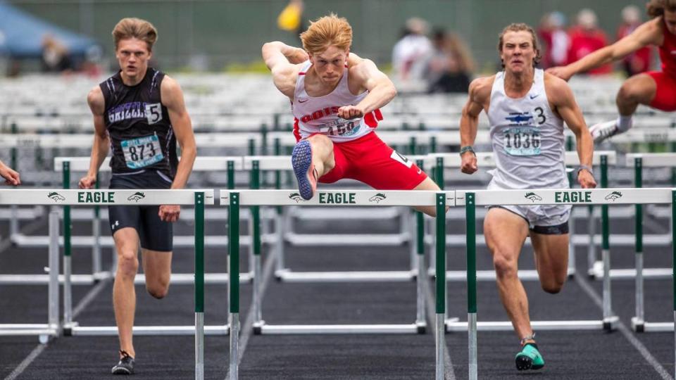 Boise High’s Anders Covey eyes the finish line as he clears the final hurdle and wins the 5A boys 110-meter hurdles Saturday, May 22, 2021, at Eagle High School.