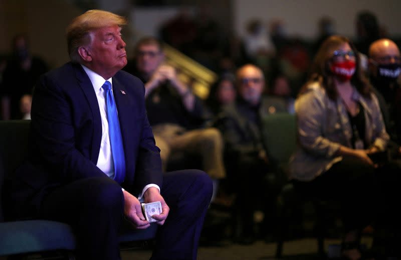 FILE PHOTO: U.S. President Donald Trump attends a service at the International Church of Las Vegas