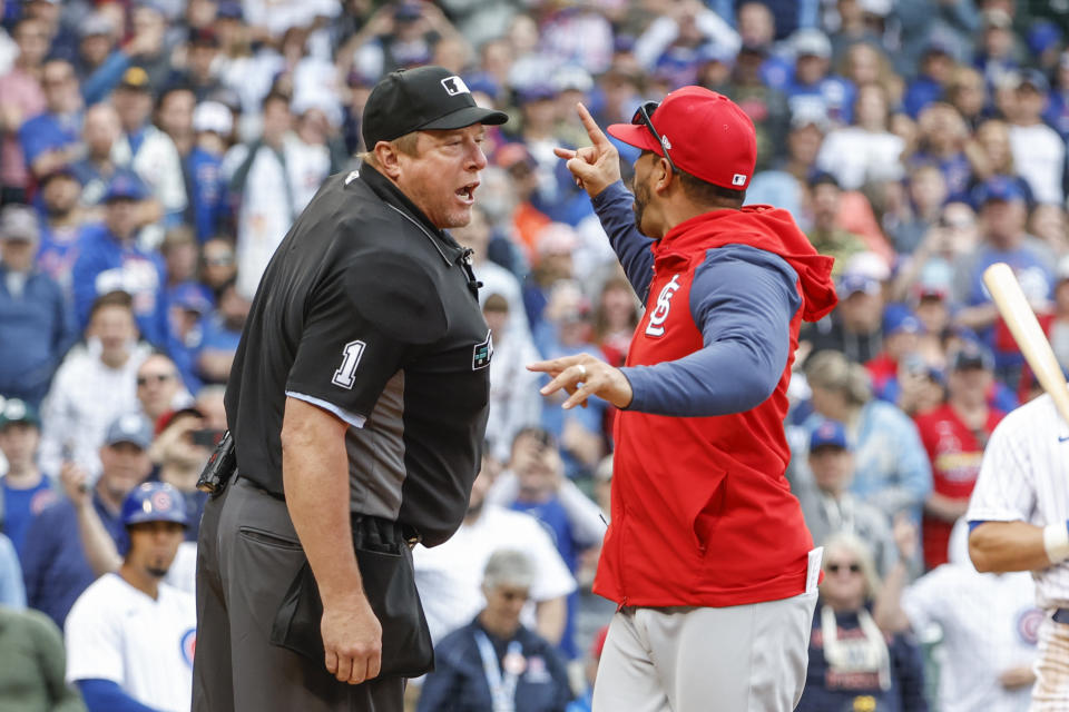 St. Louis Cardinals manager Oliver Marmol, right, argues with home plate umpire Bruce Dreckman, left, as he is ejected during the seventh inning of the first baseball game of a doubleheader, Saturday, June 4, 2022, in Chicago. (AP Photo/Kamil Krzaczynski)