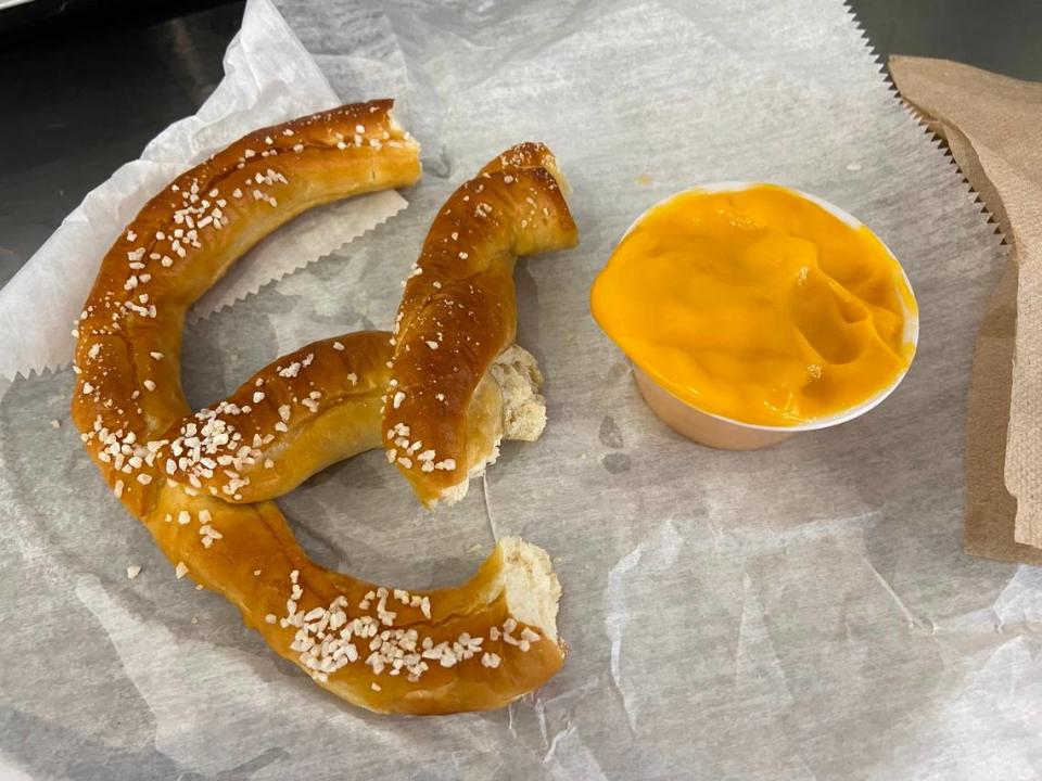A salted, soft pretzel with a cheese cup purchased from a concessions stand at Kroger Field.