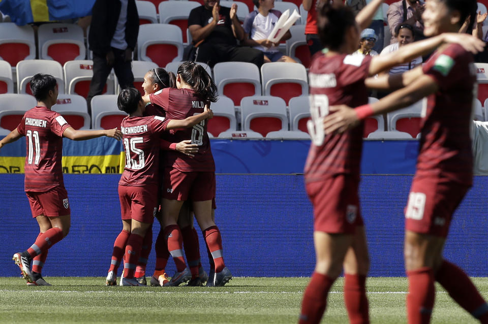 Thailand's players celkebrate their side's first goal scored by Kanjana Sung-Ngoen during the Women's World Cup Group F soccer match between Sweden and Thailand at the Stade de Nice in Nice, France, Sunday, June 16, 2019. (AP Photo/Claude Paris)