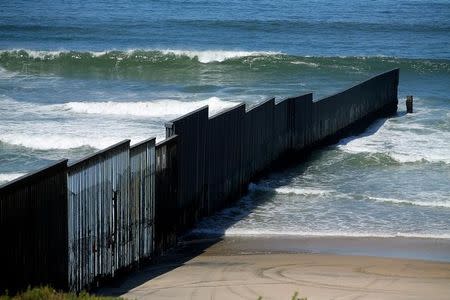 The border fence between the United States and Mexico reaches its most westerly point an ends into the Pacific Ocean at Border Field State Park near San Diego, California, U.S., April 30, 2017. REUTERS/Mike Blake/Files