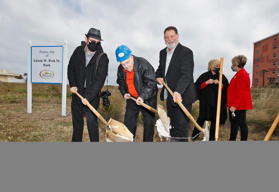 Edwin Peck Sr. breaks ground with Vice Mayor Mel Lindauer , Edwin Peck Jr., Councilwoman Billie Wheeler, Mayor Nancy Miller and Paul Culver during a ground breaking ceremony for Edwin W. Peck Sr. Park in Daytona Beach Shores, Friday, Dec. 18, 2020.