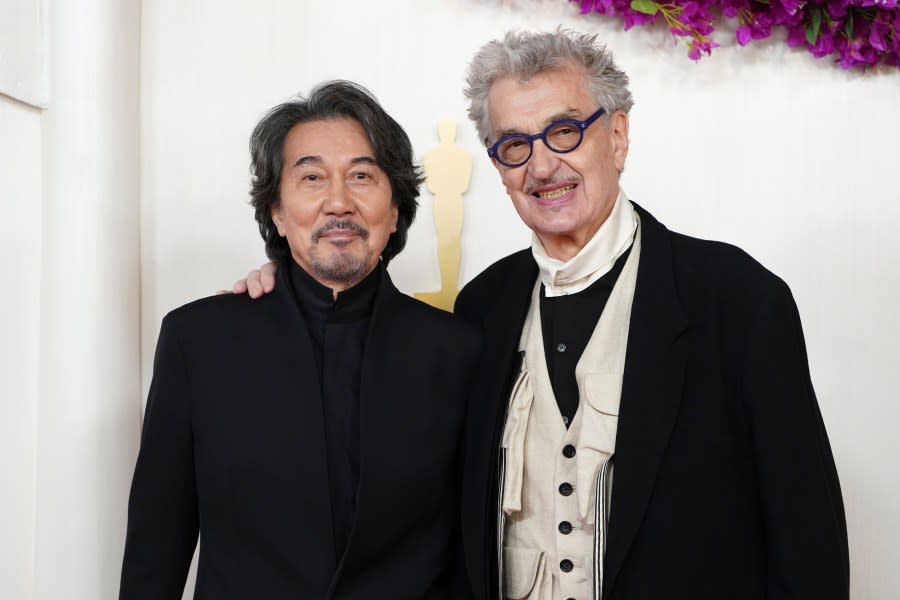 Koji Yakusho, left, and Wim Wenders arrive at the Oscars on Sunday, March 10, 2024, at the Dolby Theatre in Los Angeles. (Photo by Jordan Strauss/Invision/AP)