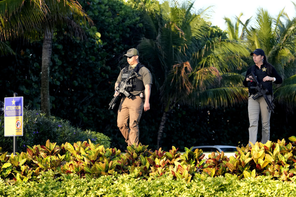Secret Service agents patrol on the property of former President Donald Trump's Mar-a-Lago estate, Sunday, April 2, 2023, in Palm Beach, Fla. Trump was indicted by a Manhattan grand jury Thursday. (AP Photo/Lynne Sladky)