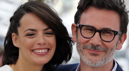 Director Michel Hazanavicius (R) and cast member Berenice Bejo pose during a photocall for the film "The Search" in competition at the 67th Cannes Film Festival in Cannes May 21, 2014. REUTERS/Eric Gaillard