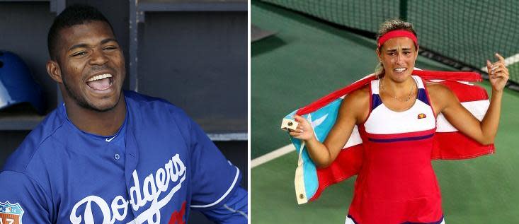 Yasiel Puig supported Monica Puig during her historic gold medal victory. (AP Photos)