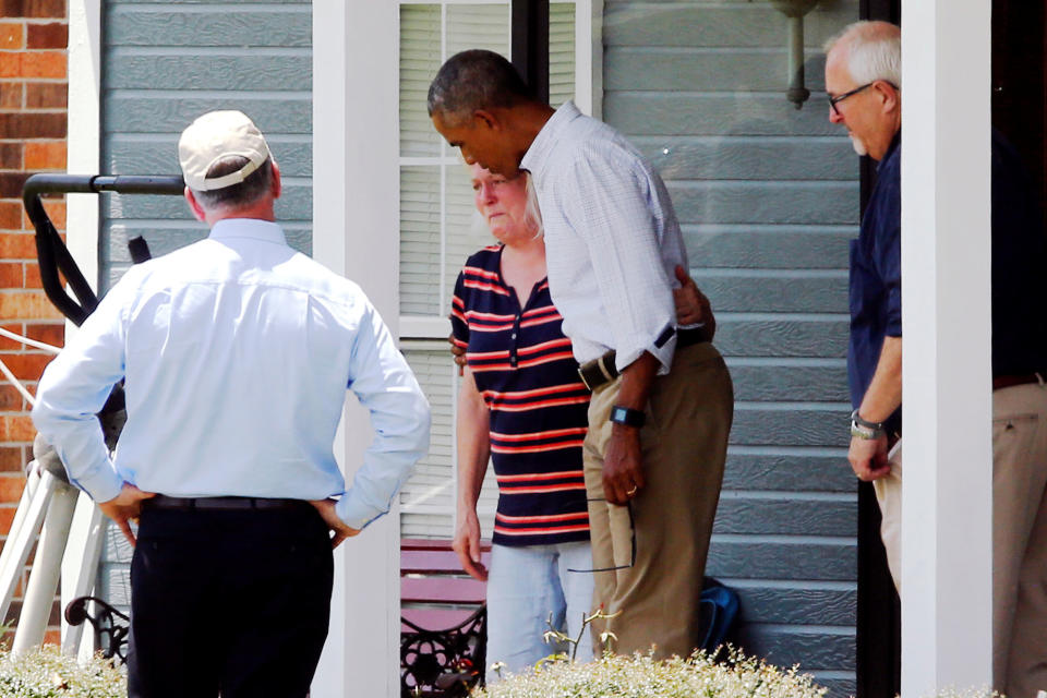<p>President Barack Obama consoles a woman after touring her flood-damaged home in Zachary, La., Aug. 23, 2016. (Photo: Jonathan Ernst/Reuters) </p>