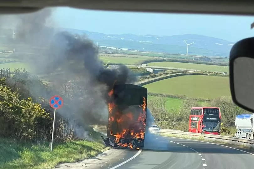 The bus burst into flames on the A30 near Temple on Monday April 22