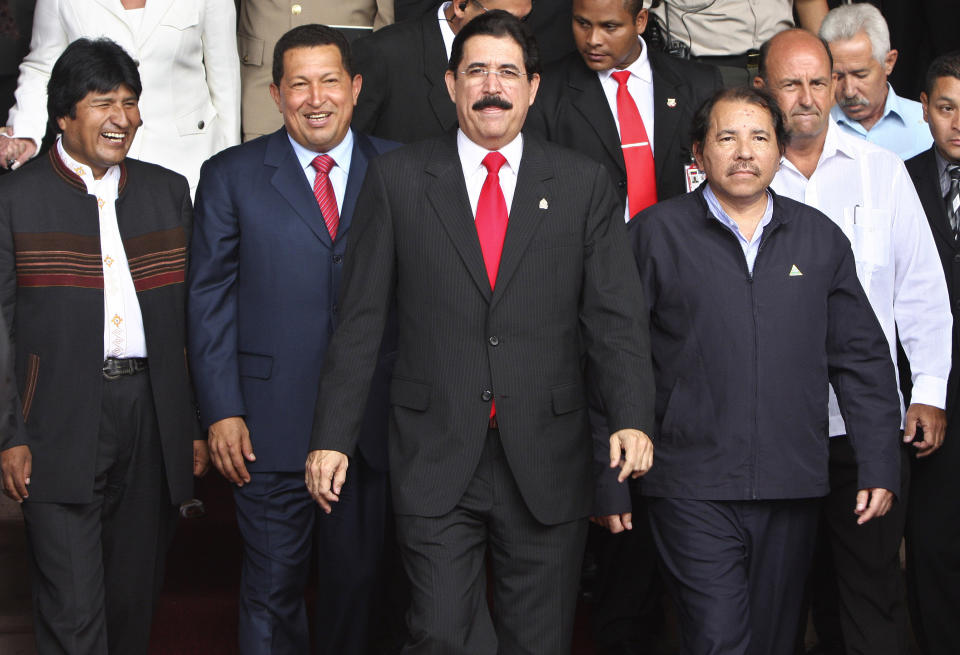 FILE - In this Aug. 25, 2008 file photo, from left, Bolivia's President Evo Morales, Venezuela's President Hugo Chavez, Honduras' President Manuel Zelaya, Nicaragua's President Daniel Ortega and Cuba's Vice President Carlos Lage, walk together at the presidential house in Tegucigalpa, Honduras. Many Hondurans still cite the U.S. government's decision to not pressure for the restoration of President Manuel Zelaya when he was ousted in a 2009 coup as a demonstration of its role as kingmaker in Honduras. (AP Photo/Esteban Felix)