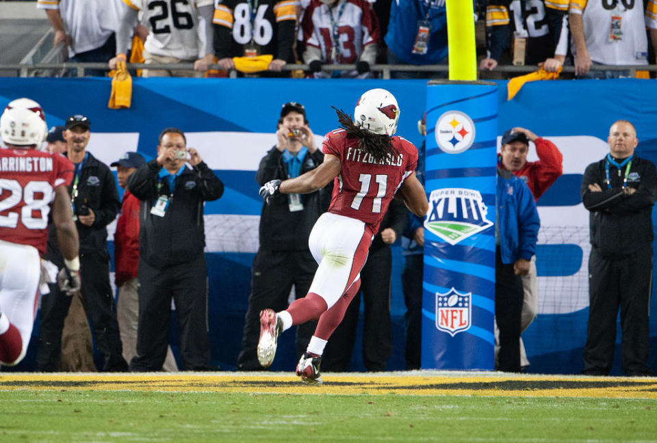 cardinals players running on the field