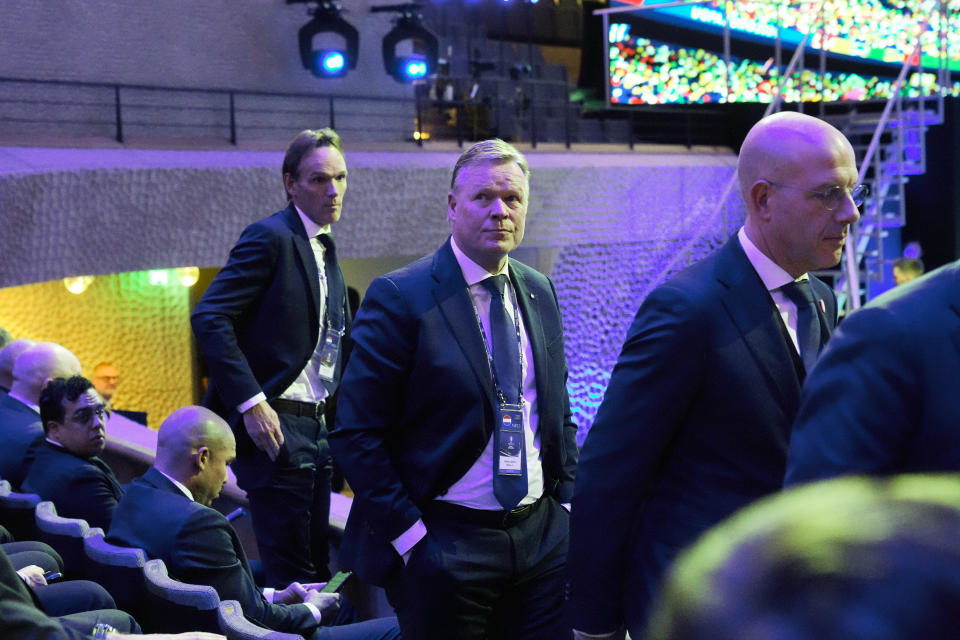 Netherlands head coach Ronald Koeman, center, leaves his seat after the draw for the UEFA Euro 2024 soccer tournament finals in Hamburg, Germany, Saturday, Dec. 2, 2023. (AP Photo/Martin Meissner)