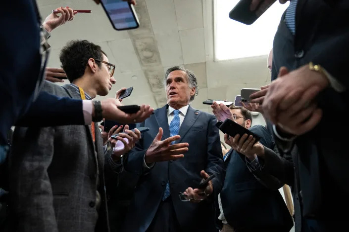 WASHINGTON, DC - Sen. Mitt Romney (R-UT) speaks to reporters in the Senate subway on his way to a vote at the U.S. Capitol March 14, 2023.