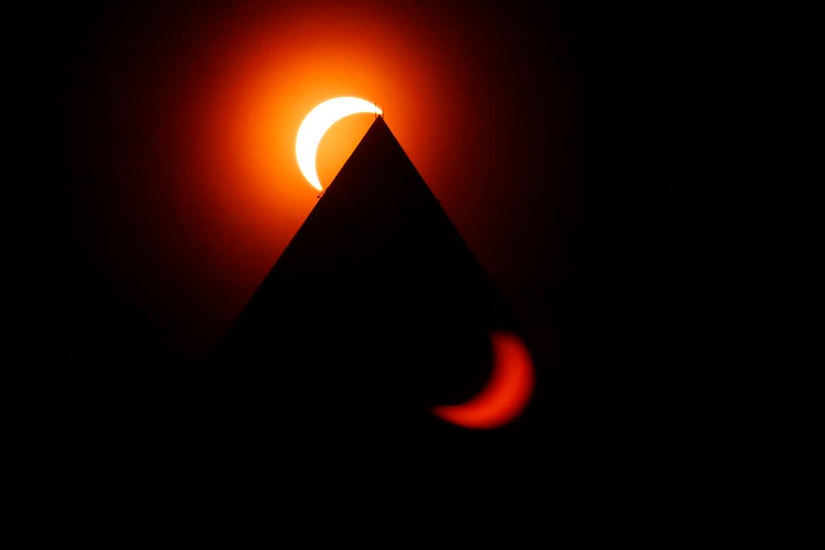 The solar eclipse is seen above the Washington Monument on April 08, 2024 in Washington, DC (Getty Images)