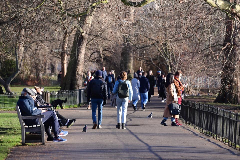 <p>People walk through Green Park during England’s third national lockdown</p> (PA)