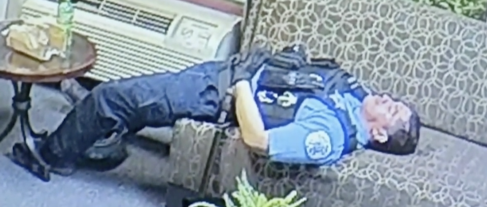 This officer was shown laying back on a couch inside US Congressman Bobby Rush’s Chicago office. Source: Fox 32