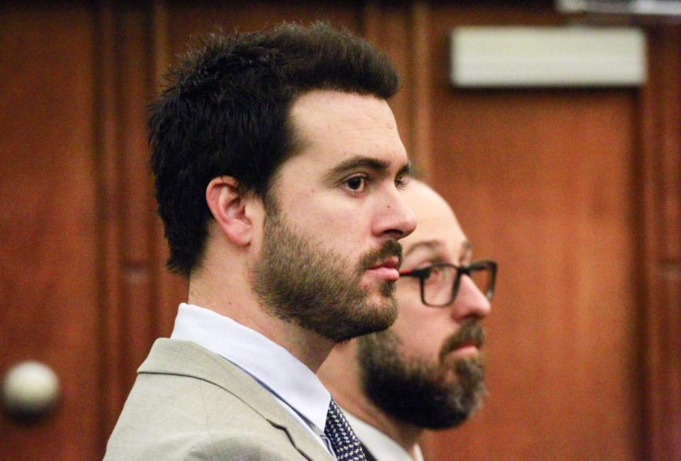 Mexican soap opera star Pablo Lyle, left, appears in court with his attorneys during his hearing, Wednesday, Jan. 22, 2020, in Miami. Florida Judge Marlene Fernandez-Karavetsos says that the Mexican actor won't be able to return to his native country while he awaits trial on a charge he fatally punched a man during a road-rage confrontation. (Carl Juste/Miami Herald via AP, Pool)