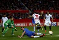 Football Soccer - Sevilla v Molde FK- UEFA Europa League Round of 32 First Leg - Ramon Sanchez Pizjuan stadium, Seville - 18/2/16 Sevilla's Ever Banega (2nd R) and Molde's Vegard Forren in action. REUTERS/Marcelo del Pozo