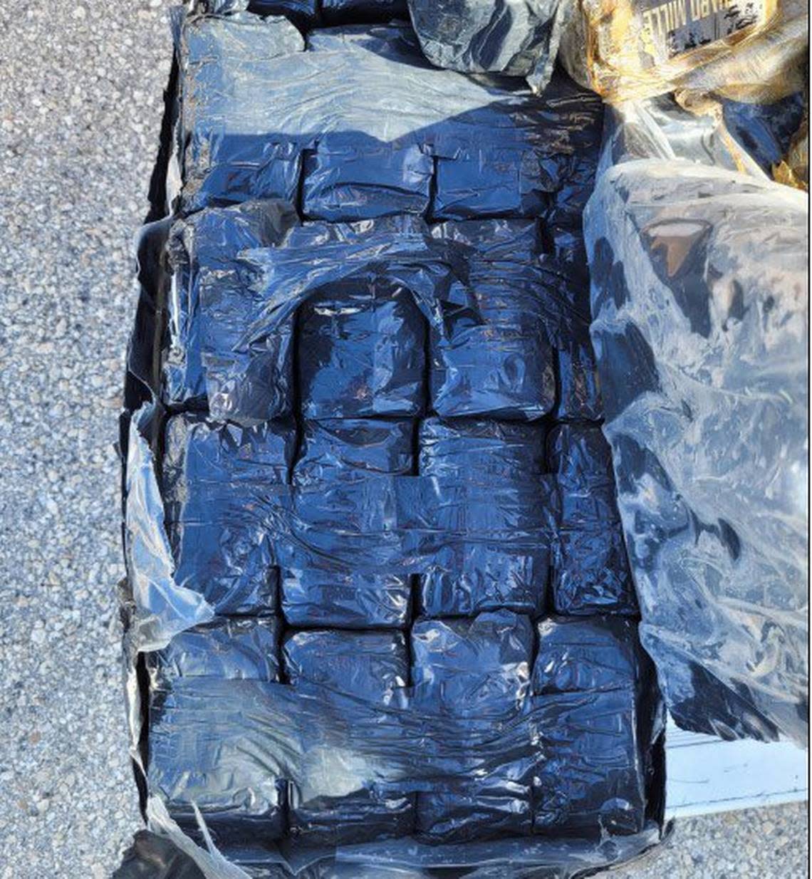 A large amount of bundled hashish is displayed. The drugs were found by a boater off the Florida Keys Sunday, July 2, 2023, according to the U.S. Border Patrol.