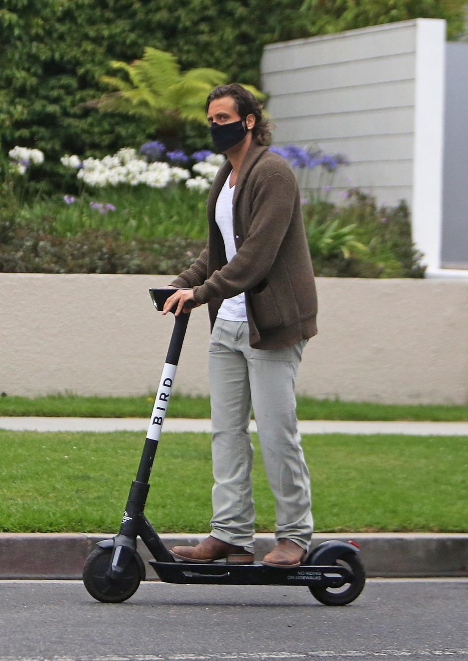 <p>Brad Falchuk finds a new way to get some fresh air — a Bird electric scooter! — in L.A. on Wednesday.</p>