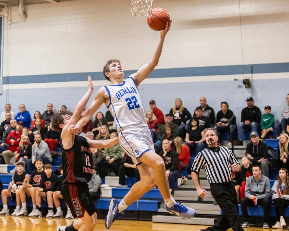 Berlin Brothersvalley's Pace Prosser drives past Conemaugh Township's Stephen Stango during the championship game of the Berlin Veterans' Home Association Holiday Basketball Tournament, Dec. 28, in Berlin.