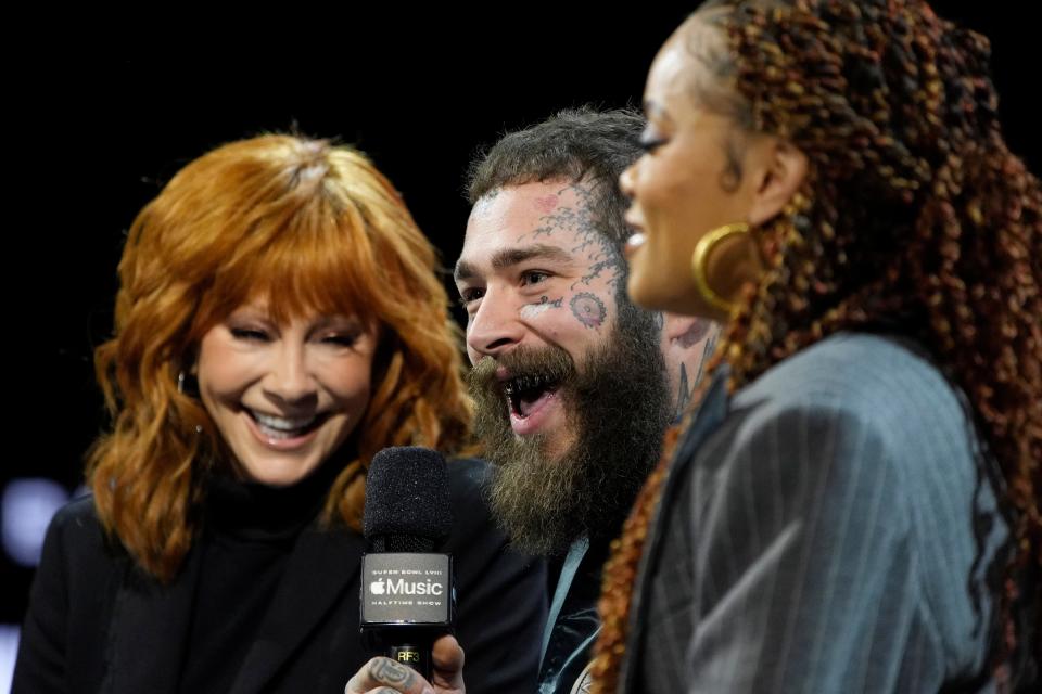 From left, Reba McEntire, Post Malone and Andra Day share Super Bowl memories at a press conference in Las Vegas on Feb. 8, 2024.