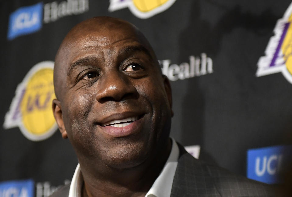 FILE - In this April 9, 2019, file photo, Magic Johnson speaks to reporters prior to an NBA basketball game between the Los Angeles Lakers and the Portland Trail Blazers, in Los Angeles. (AP Photo/Mark J. Terrill, File)