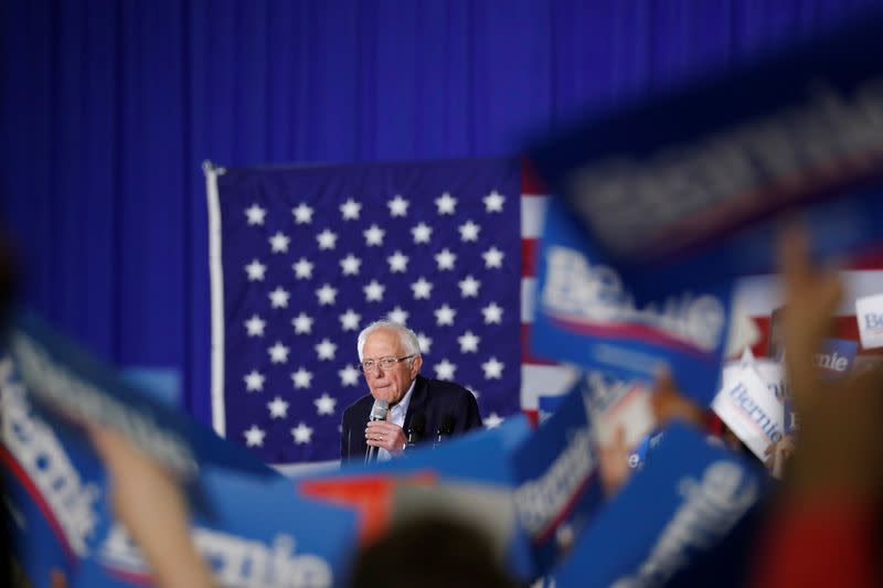 Supporters of U.S. Democratic presidential candidate Sanders react as he speaks during a rally in Detroit