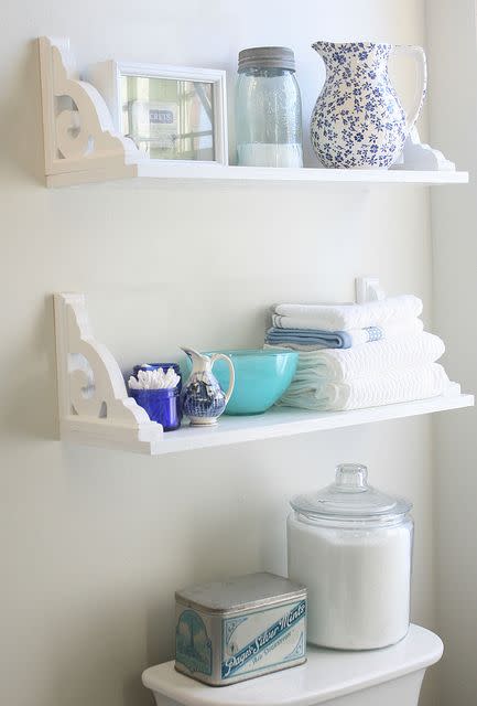 bathroom storage ideas, inverted shelved with toiletries on top