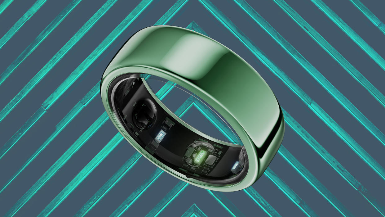  Green smart ring against surface with chevrons. 