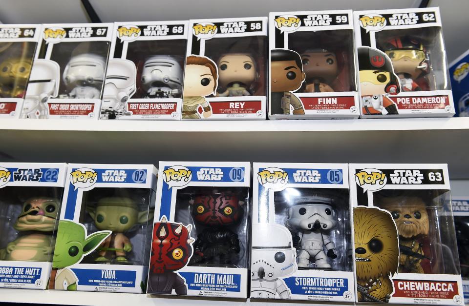 TO GO WITH AFP STORY BY JOCELYN ZABLIT, "The Merch Awakens: 'Star Wars' blitz before film opens" Funko Pop Star Wars action figures line the shelves at Meltdown Comics and Collectibles in Los Angeles on October 30, 2015. From action figures, to boxer shorts, pasta, duct tape and pet outfits, Disney is pulling out all the stops before the release of the new Star Wars movie with a massive merchandising blitz expected to reap billions. The push to drive up excitement for the film began in earnest in September -- nearly four months before "Star Wars: Episode VII - The Force Awakens" hits screens -- and has been mounting since, with ecstatic fans around the globe snapping up advance tickets along with products related to the film's beloved characters.    AFP PHOTO / ROBYN BECK        (Photo credit should read ROBYN BECK/AFP/Getty Images)