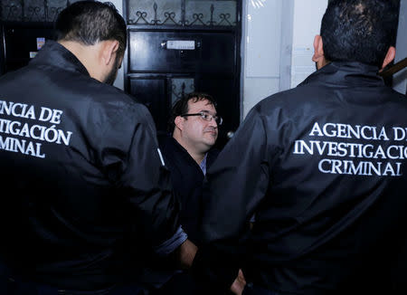 Former governor of Mexican state Veracruz Javier Duarte (C) sits at a police station after he was detained in a hotel in Panajachel, Guatemala April 15, 2017. REUTERS/Danilo Ramirez