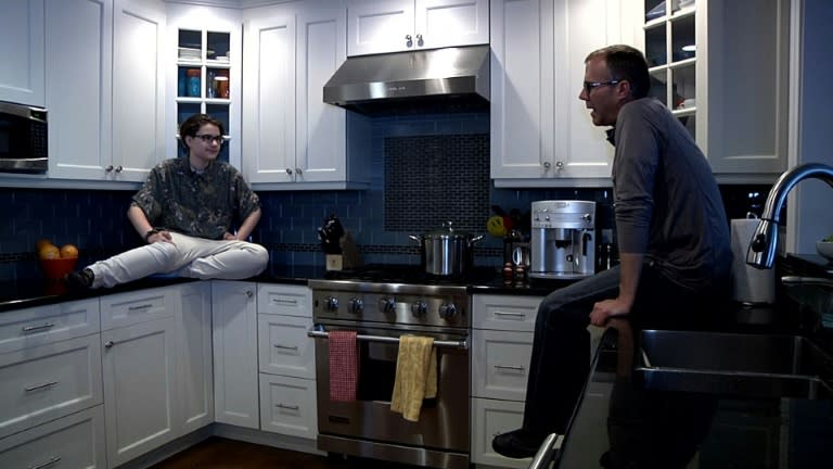 Arthur Brown, who is transgender -- born female but now identifying as male, speaks with his father in their kitchen in Chicago, Illinois on on May 17, 2016