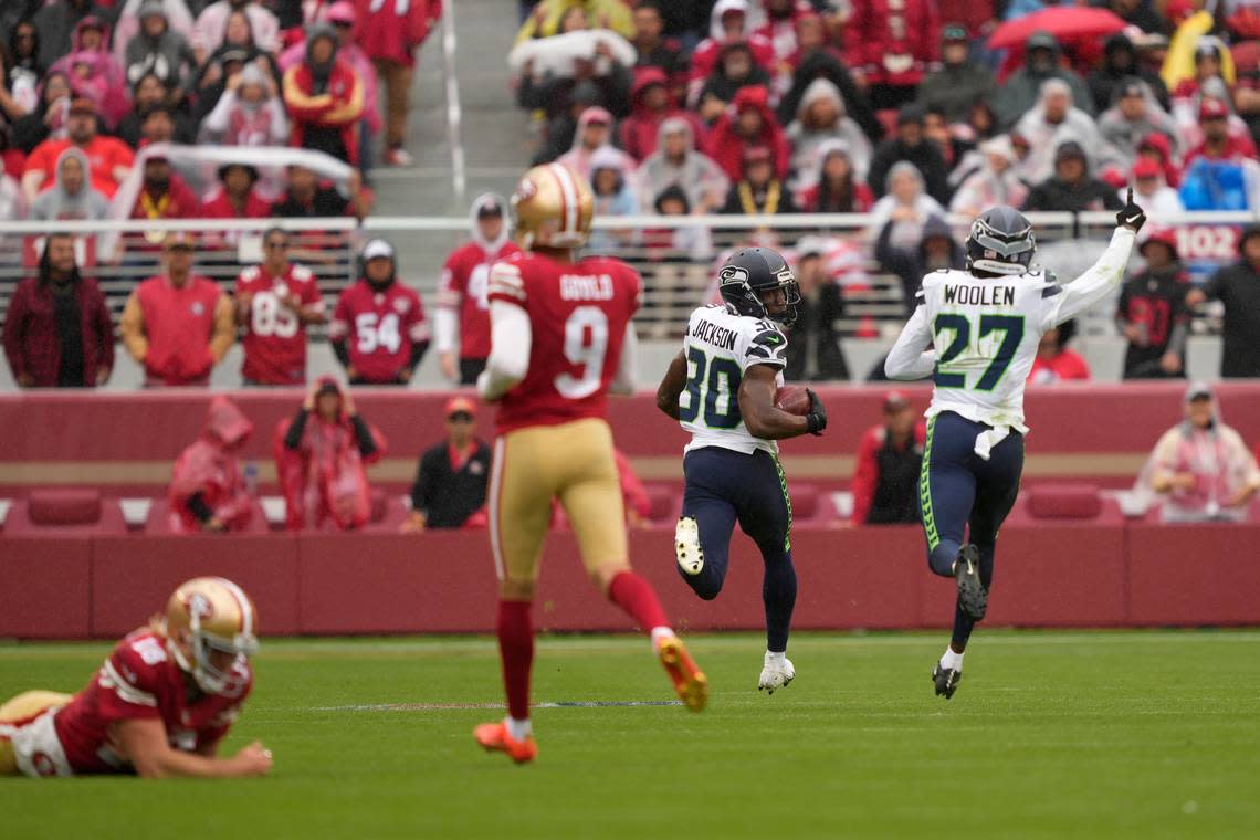 Seattle Seahawks’ Mike Jackson (30) returns a blocked field goal for a touchdown next to Tariq Woolen (27) past San Francisco 49ers’ Mitch Wishnowsky, left, and place kicker Robbie Gould (9) during the second half of an NFL football game in Santa Clara, Calif., Sunday, Sept. 18, 2022. (AP Photo/Tony Avelar)
