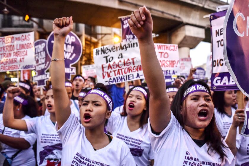 Women join a protest march for International Women's Day