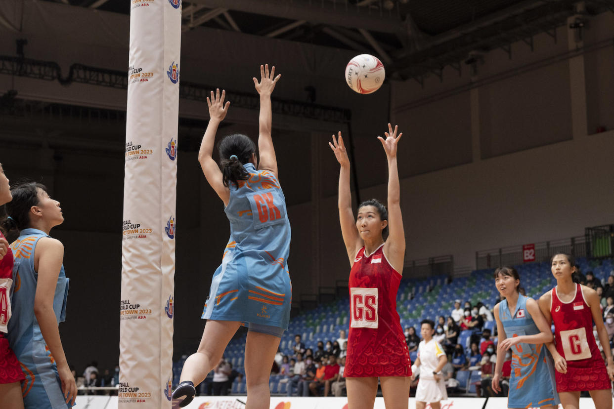 Singapore's goal shooter Charmaine Soh shoots the ball over her Japanese rival at the Asian Netball Championships. (PHOTO: Netball Singapore)