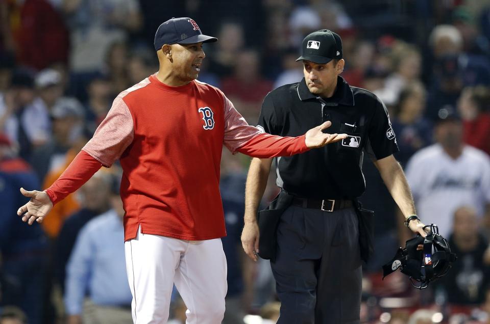 Boston Red Sox manager Alex Cora, left, talks with home plate umpire David Rackley after Ian Kinsler was called out on strikes during the eighth inning of a baseball game in Boston, Saturday, Sept. 8, 2018. (AP Photo/Michael Dwyer)
