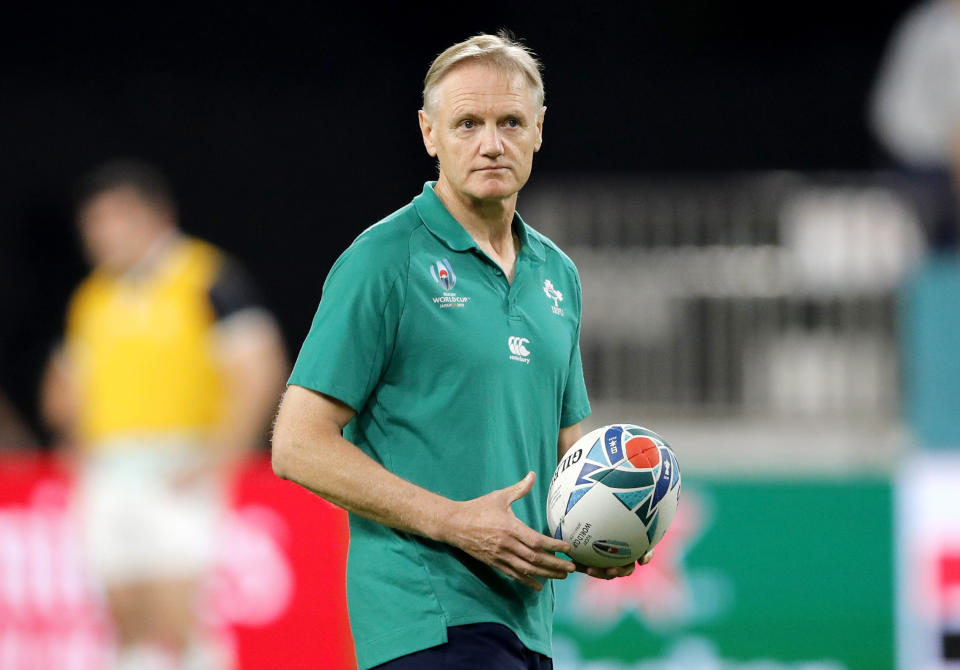 FILE - In this Oct. 3, 2019, file photo, Ireland's coach Joe Schmidt watches as his players warm up ahead of the Rugby World Cup Pool A game at Kobe Misaki Stadium between Ireland and Russia, in Kobe, Japan. Of the eight teams remaining in the Rugby World Cup four are coached by New Zealanders who, from similar beginnings, pursued divergent coaching careers before their paths intersected at this tournament. (AP Photo/Christophe Ena, File)