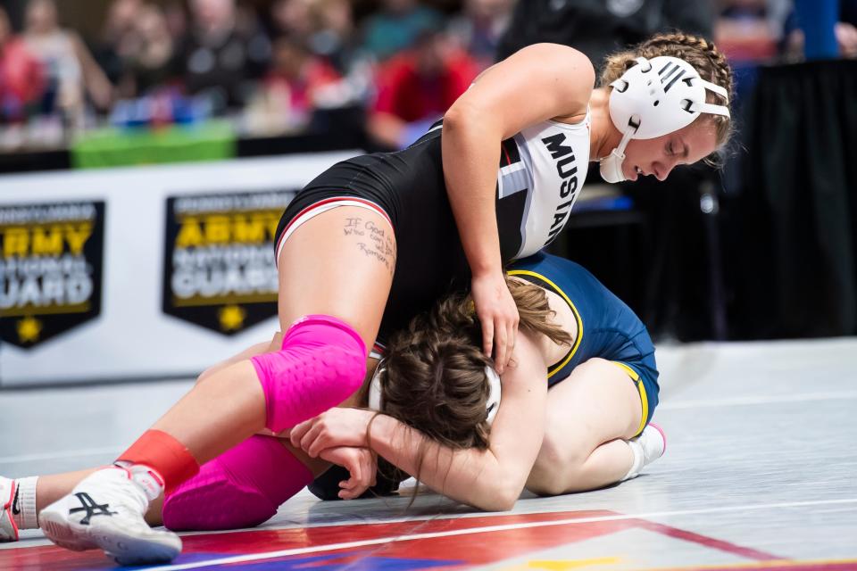 South Western's Tatum Duckworth (top) wrestles Mt. Lebanon's Paige Jox in a 124-pound consolation bout at the PIAA Class Girls' Wrestling Championships at the Giant Center on March 8, 2024, in Hershey.