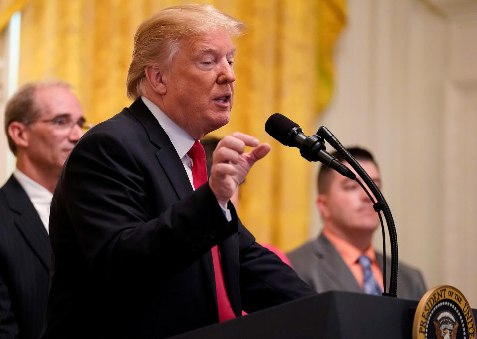 U.S. President Donald Trump delivers remarks to mark six months since the passage of the Tax Cuts and Jobs Act, in the White House East Room in Washington, U.S., June 29, 2018. REUTERS/Jonathan Ernst